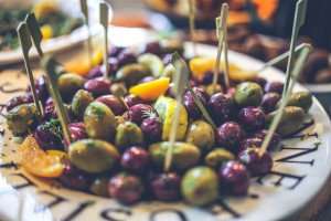 Marinated spiced olives served as an appetizer.