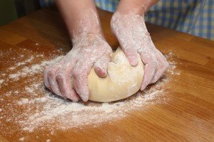 Kneading dough during a cooking class in Italy