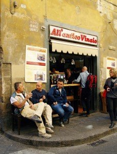 Hanging out at the wine shop on an Italy culinary tour