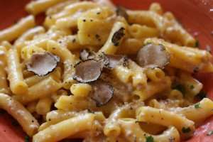 A tasty plate of fresh maccheroni with truffles during a cooking vacation in Italy.
