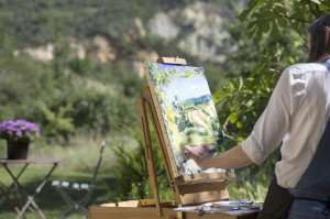 Painting in the open air during a culinary and art tour with The International Kitchen.