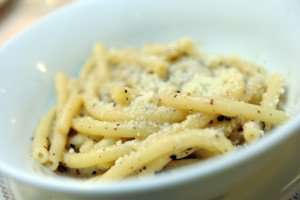 A plate of bucatini pasta "cacio e pepe," a traditional Roman pasta dish.