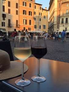 Enjoying a glass of wine in a Roman piazza during our culinary vacations in Italy.
