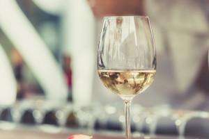 A glass of white wine on a food and wine tour with TIK