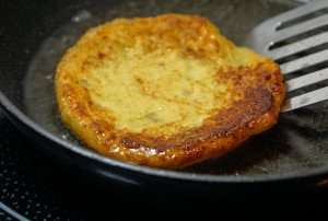 Potato pancake on the skillet.