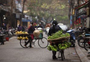 Vendors selling fruit on bikes during a culinary tour of Vietnam