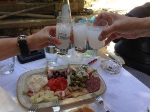 Enjoying ouzo with appetizers on a culinary tour of Greece