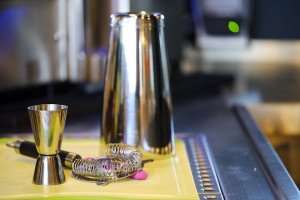 A bartender's tools, a shaker and jigger.