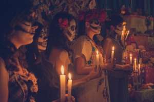 Dressing up for the Day of the Dead to honor loved ones.