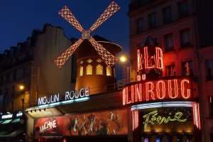 Enjoying a night out at the famous Moulin Rouge cabaret.