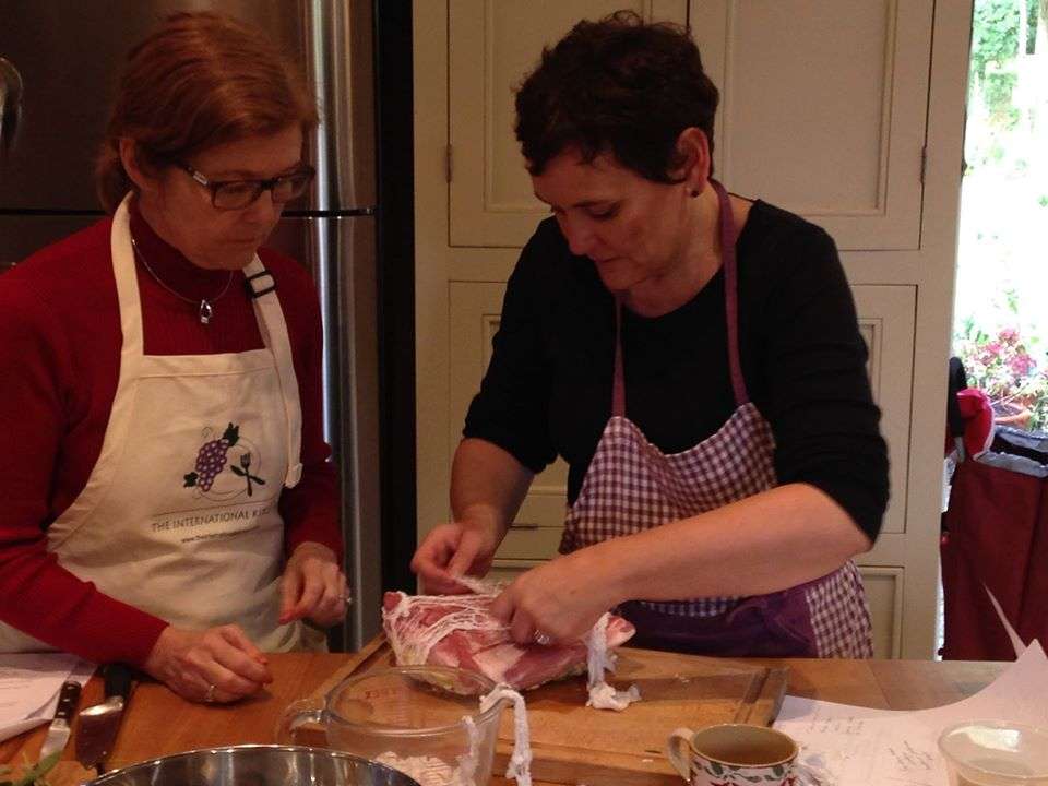 Hard at work during our authentic cooking classes in Normandy.