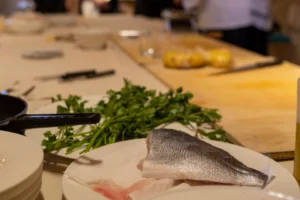 Working on a fish dish during a cooking class in Molise.