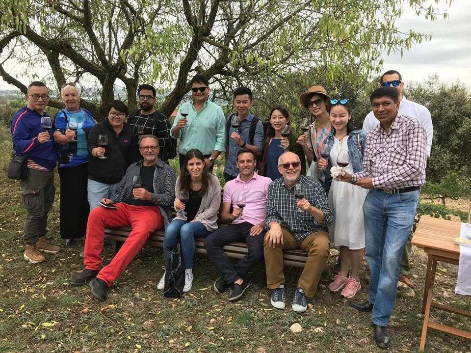 A group toast during a Spain wine tasting tour.