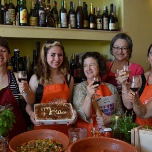 Toasting with Mamma during your cooking vacation in Italy
