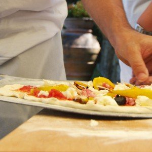 Making pizza during a cooking class in Italy