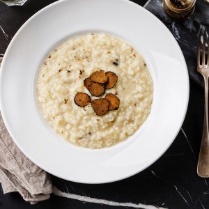 Plate of risotto with truffles on a culinary tour to Italy