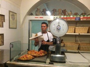A vendor selling street food in Puglia on a culinary tour of Italy