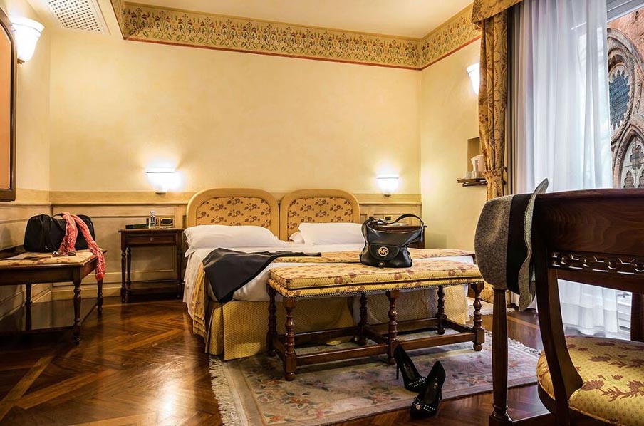 Image for Bedroom at Hotel Commercianti in Bologna, home for your cooking vacation in Italy