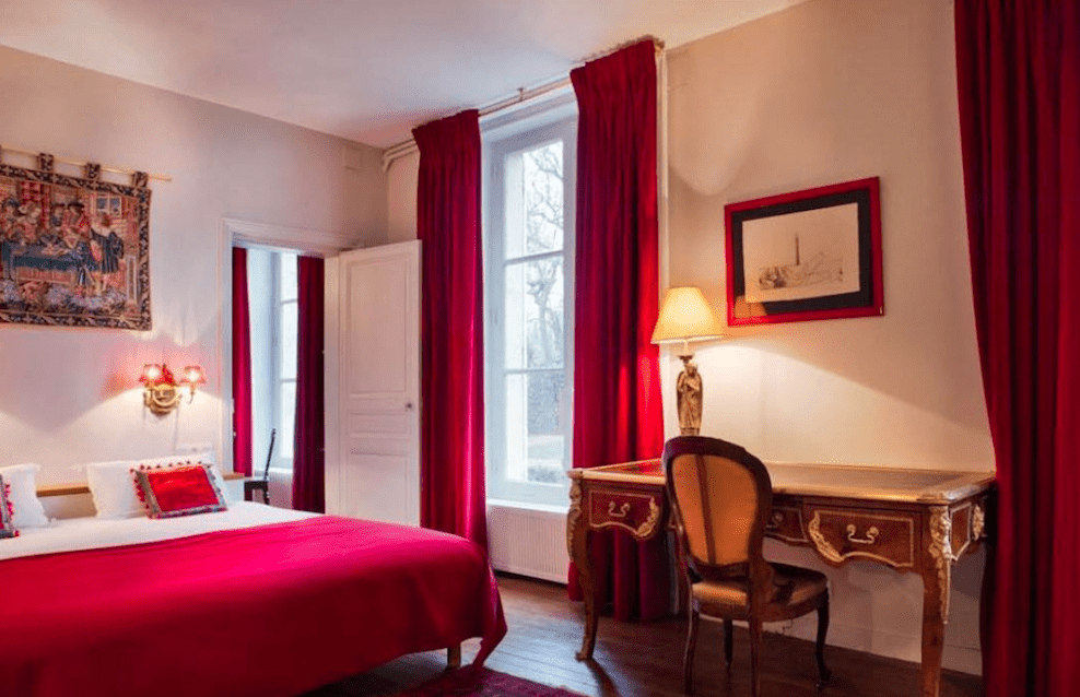 Image for Red bedroom at the 4* Clos d'Amboise, home for your Loire Valley wine tour.