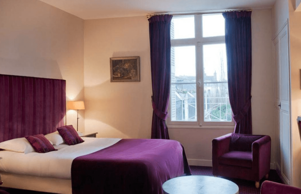 Image for Purple bedroom at the 4* Clos d'Amboise, home for your Loire Valley wine tour.