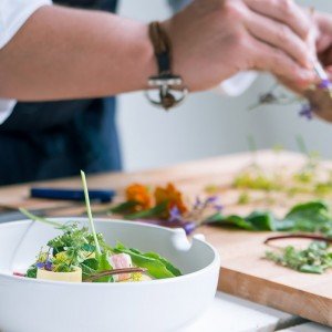 Preparing an elegant plate of food during a cooking class