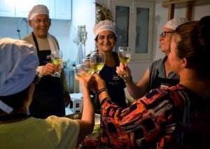 Toasting with the chef during your Greek cooking vacation