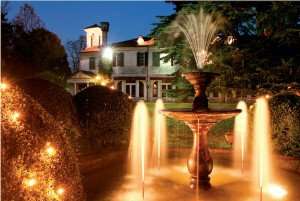 The Villa Luppis and its gardens at night time.