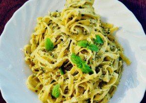 Tagliatelle pasta with pesto enjoyed on a Ligurian cooking vacation