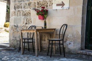 Table with bottle of wine on a culinary tour of Italy
