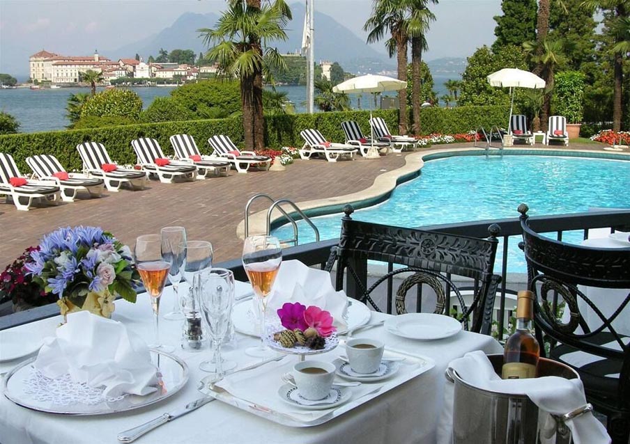 Image for Poolside table at Villa Aminta on Lake Maggiore during a culinary vacation in Italy