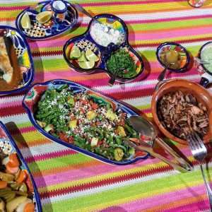 Enjoying a Mexican feast prepared during one of your hands-on cooking classes.