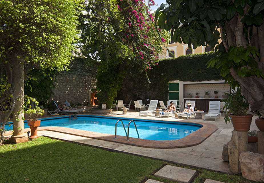Image for Garden and pool at the Hotel del Balam in Merida, Mexico.