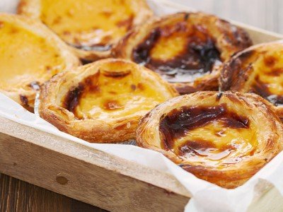 Pasteis de nata enjoyed on a culinary tour of Portugal