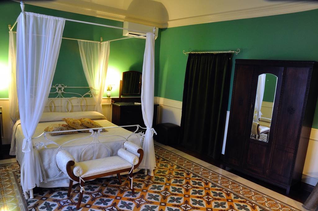 Image for Elegant bedroom at Relais Briuccia on a Sicily cooking vacation