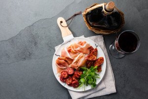 Ham and wine during a culinary tour of Spain with TIK