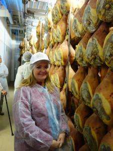 Visiting a prosciutto maker on an Italy food tour.