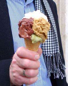 Three flavors of gelato on a cone during an Italy food tour.