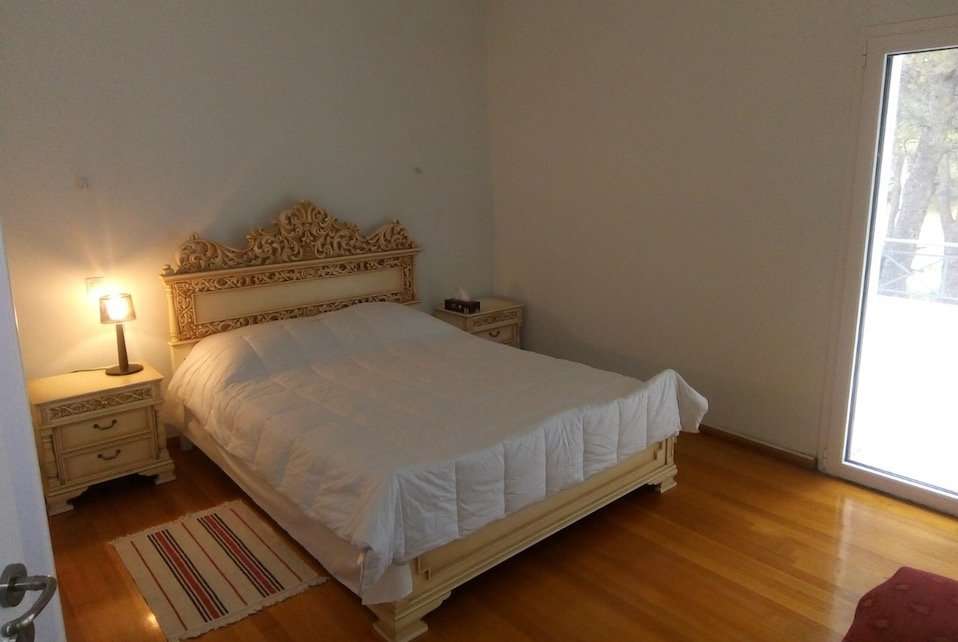 Image for Bedroom at the villa where you stay on your Athens cooking vacation and food tour.