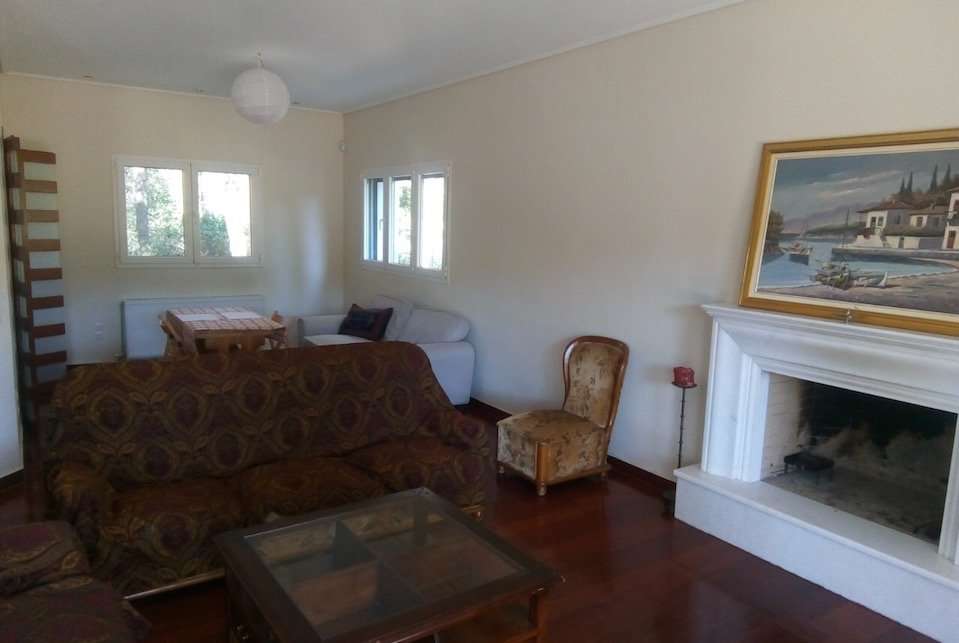 Image for The living room and fireplace of your villa outside of Athens.