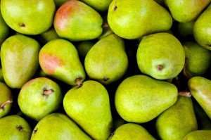 A beautiful basket of pears.