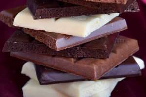 A stack of different types of chocolate.