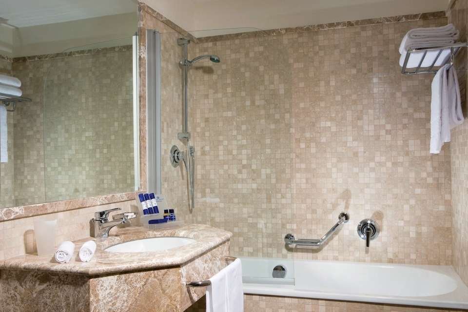 Image for Bathroom of a Superior Seaview room at the Royal Continental Hotel in Naples.