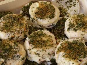 Fresh goat cheese with herbs on a culinary vacation in France.