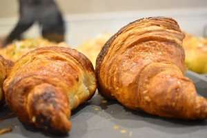 Close up of flaky croissants showing the laminated finish.