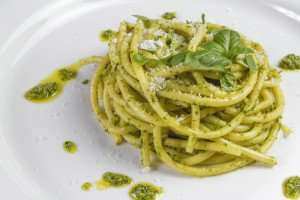 Spaghetti with a traditional pesto alla genovese on an Italy cooking vacation.