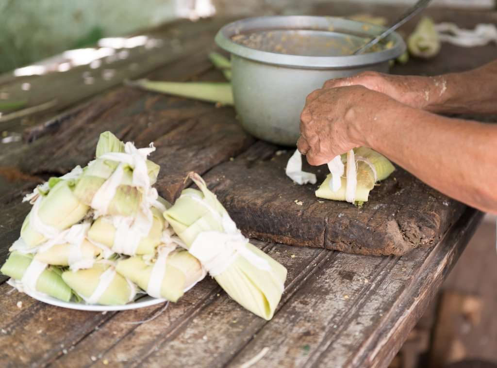 Maxing tamales during an authentic hands-on cooking vacation in Mexico with The International Kitchen.