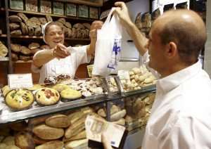 Visiting a local bakery with the chef during a cooking class in Rome.