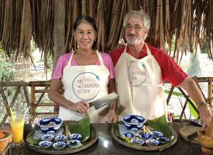 A couple enjoying a cooking class in Vietnam.