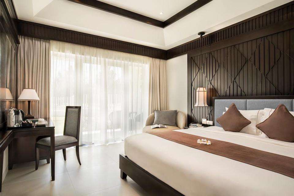 Image for Bedroom at the Boutique Hoi An Resort, home for your Vietnam culinary tour.