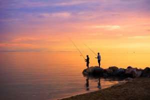 Fishing at sunset during your Greek cooking vacation.